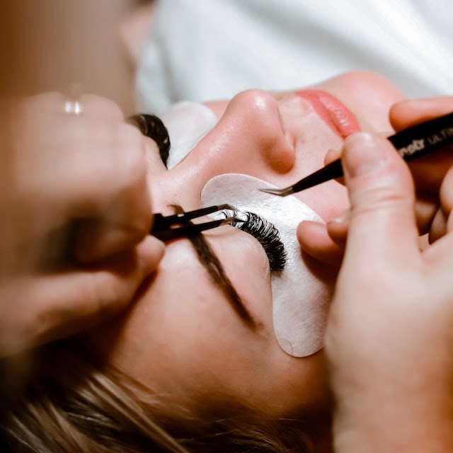Careful application of individual eyelash extensions